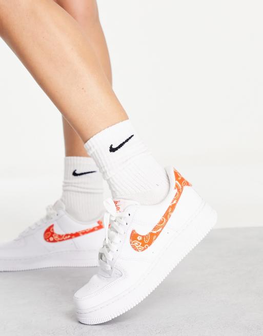 Nike Air Force 1 '07 ESS sneakers in white and orange | ASOS