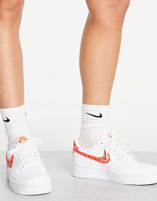 Deplete go to work Woman Nike Air Force 1 '07 ESS sneakers in white and orange | ASOS