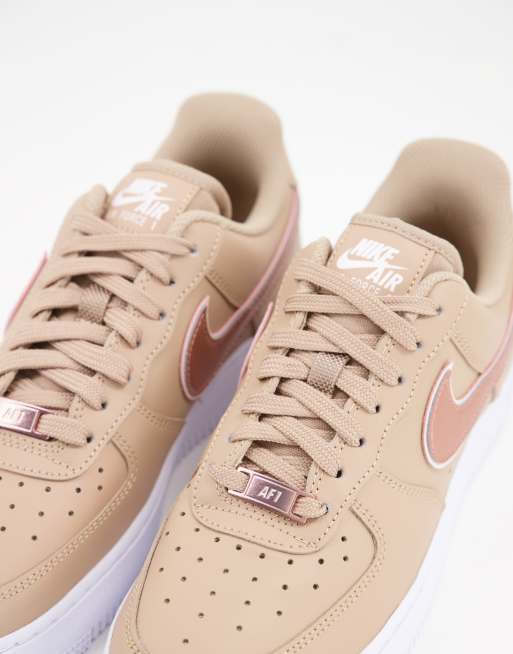 White and rose gold air store force ones