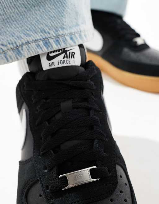 Nike Air Force 1 07 LV8 gum sole sneakers in black and white