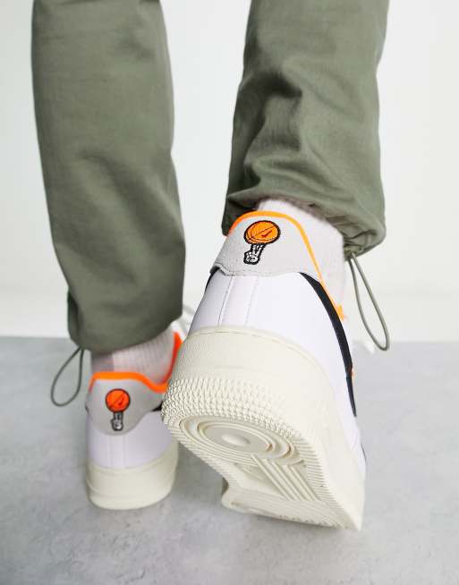 Nike Air Force 1 '07 ESS sneakers in white and orange