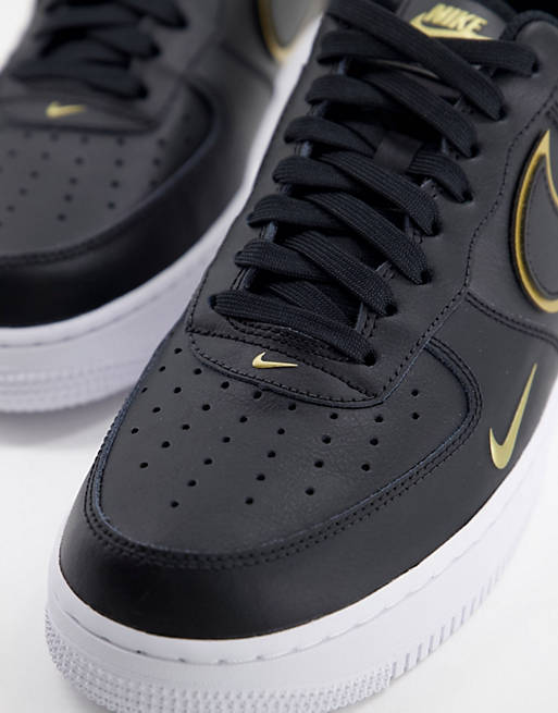 Nike - Air Force 1 - '07 LV8 - Sneakers in zwart en goud
