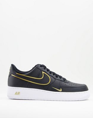 Nike Air Force 1 '07 LV8 trainers in black and gold