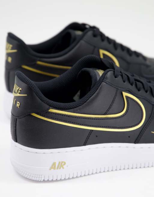 Nike Air Force 1 07 LV8 trainers in black and gold