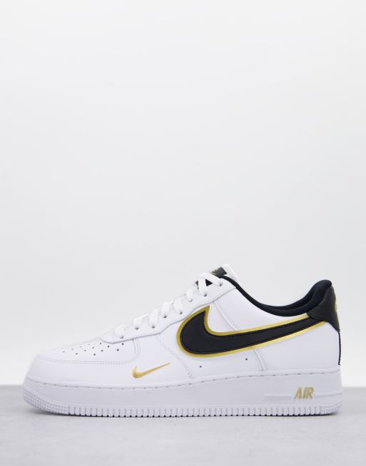 Nike Air Force 1 07 LV8 trainers in white and gold