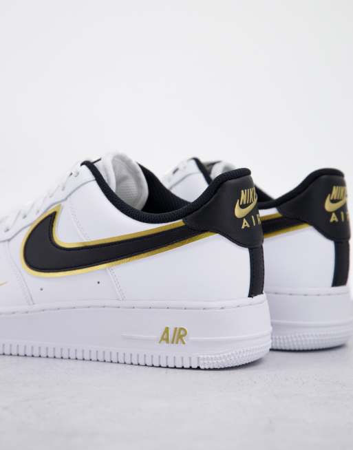 Nike Air Force 1 07 LV8 trainers in white and gold