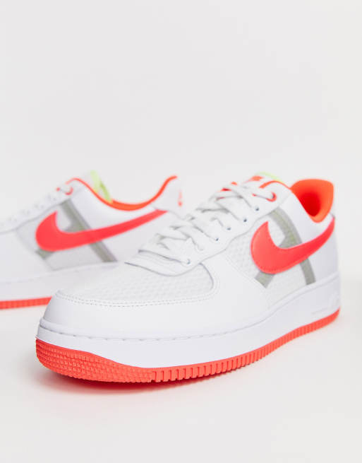 Nike Air Force 1 07 LV8 trainers in white with pink swoosh