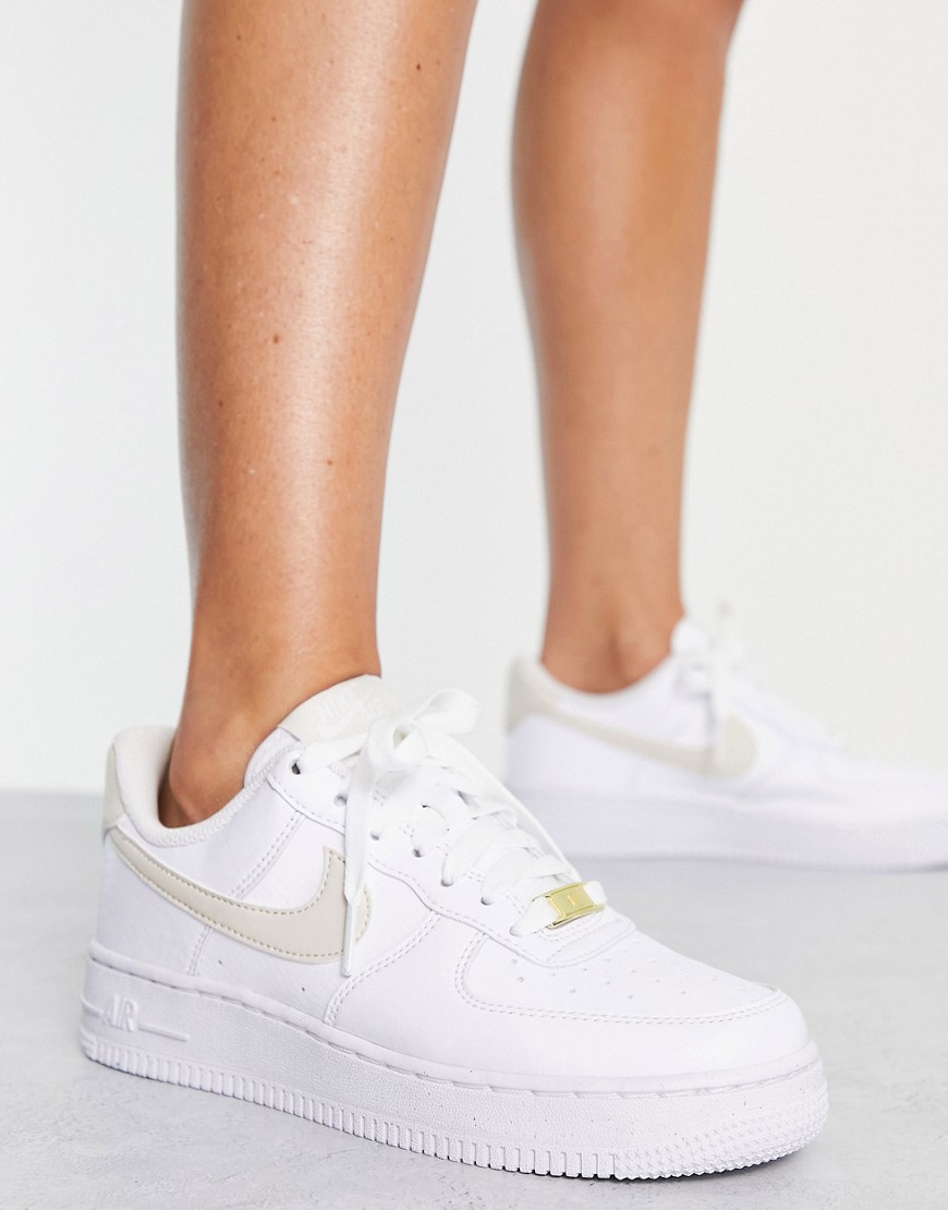 Nike Air Force 1 '07 Next Nature sneakers in white and gold metallic