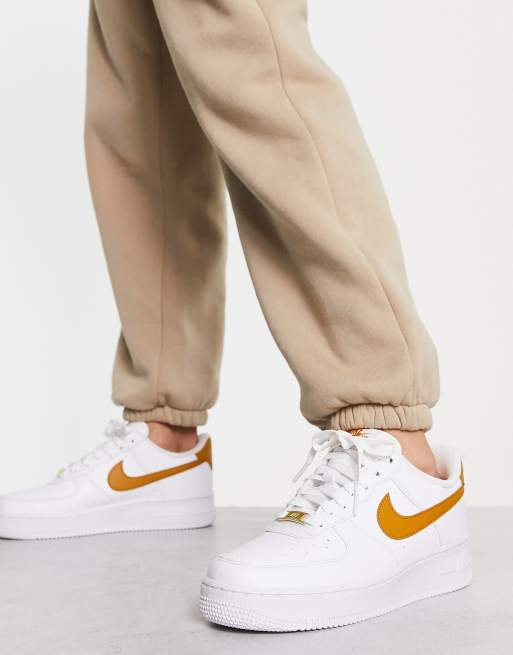 Nike Air Force 1 '07 Next trainers in white and gold yellow | ASOS