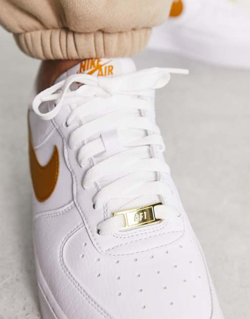 Nike Air Force 1 07 Next trainers in white and gold yellow