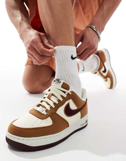 Nike Air Force 1 07 sneakers in brown and off white