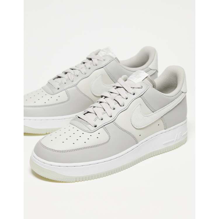 Nike Air Force 1 07 sneakers in gray and white