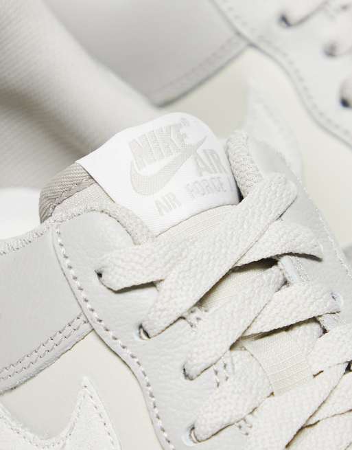 Nike Air Force 1 07 sneakers in gray and white