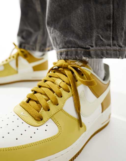 Nike Air Force 1 07 sneakers in mustard and off white