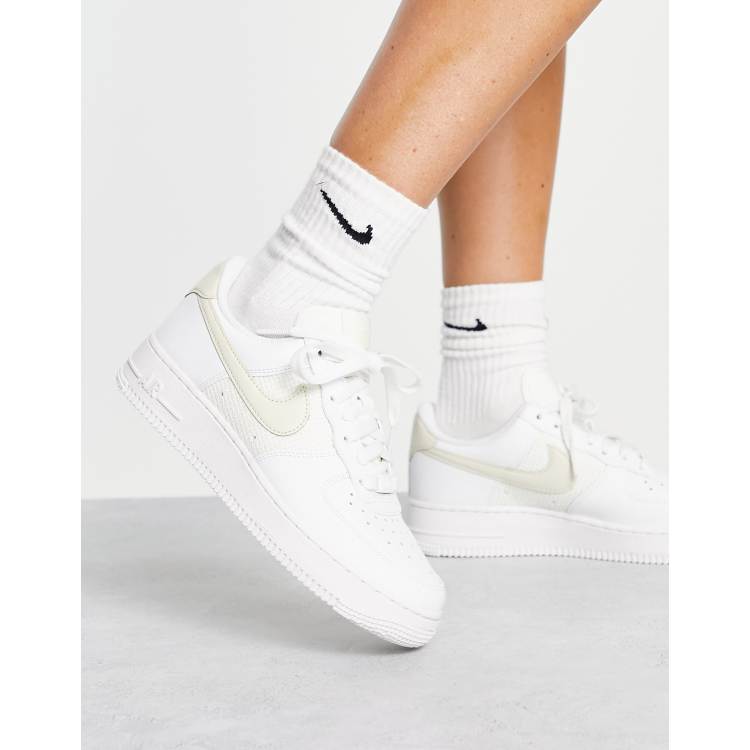 white and yellow nikes