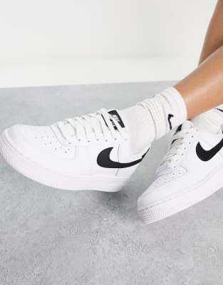 Shop Nike Air Force 1 '07 Sneakers In White And Black