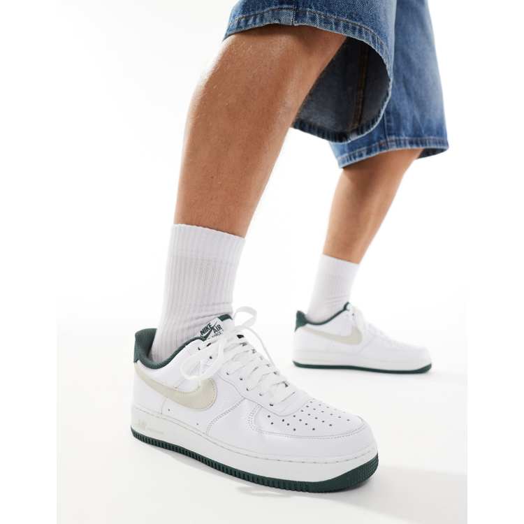 Nike Air Force 1 07 sneakers in white and dark green ASOS