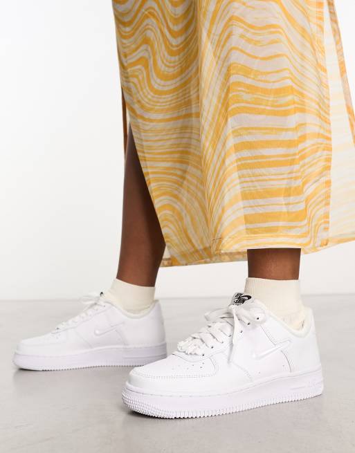 Nike Air Force 1 '07 sneakers in white and iridescent swoosh | ASOS