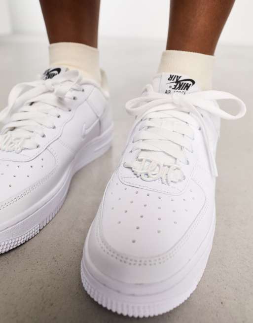 Nike Air Force 1 '07 sneakers in white and iridescent swoosh | ASOS