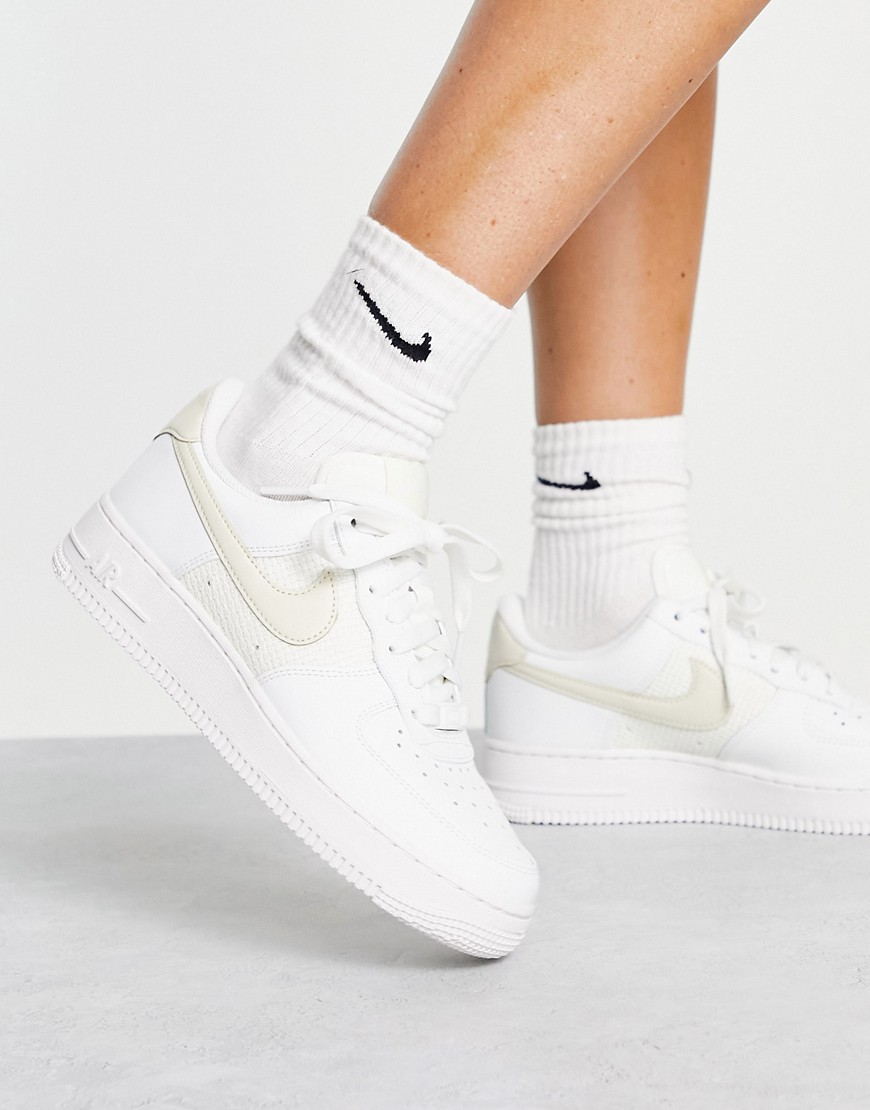 Nike Air Force 1 '07 trainers in white and baby yellow