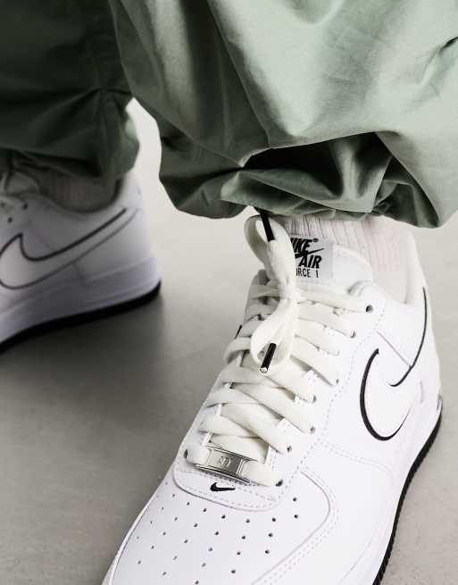 Nike Air Force 1 07 trainers in white and black outlined ASOS