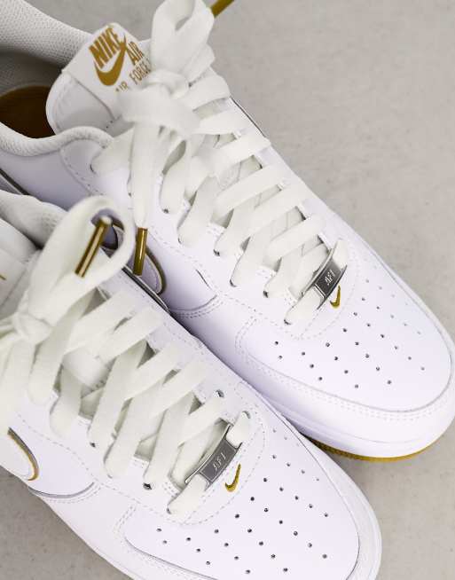 Nike Air Force 1 07 trainers in white and bronze ASOS