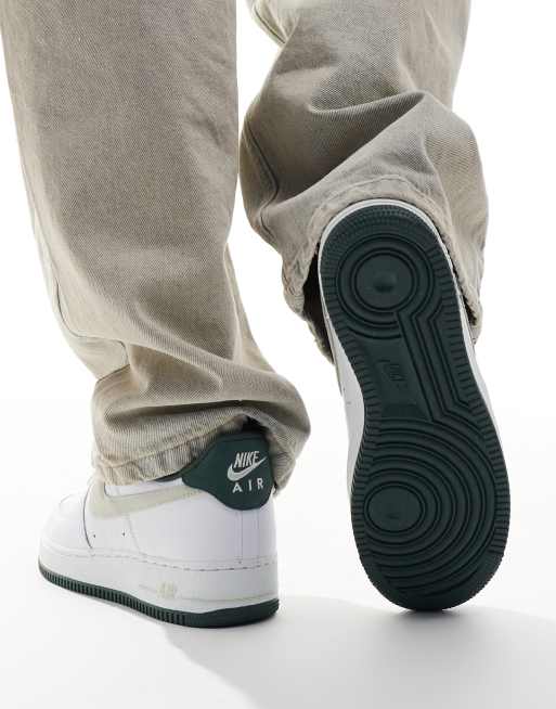 Nike Air Force 1 07 trainers in white and dark green