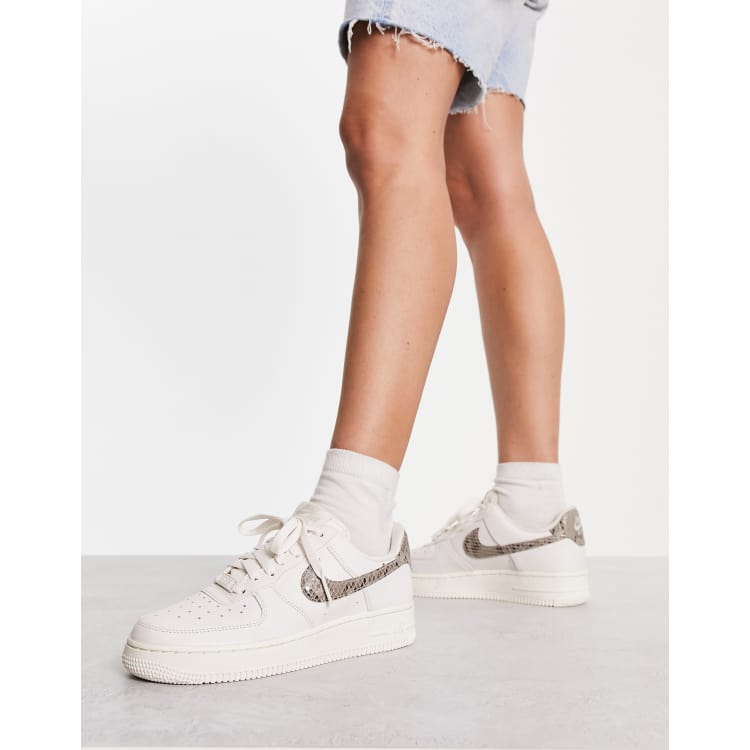 Nike Air Force 1 07 trainers in white and snake print ASOS