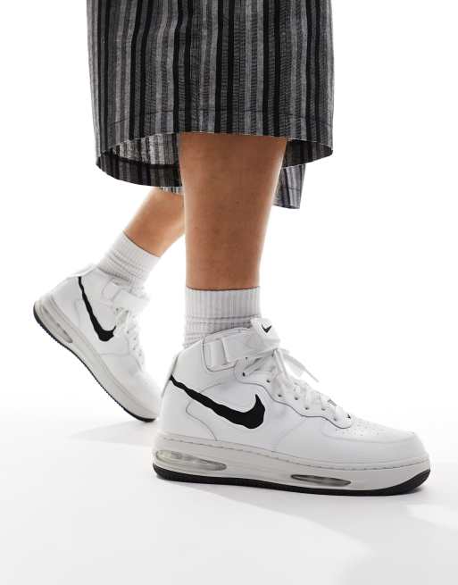 Nike Air Force 1 Mid Remastered sneakers in white and black