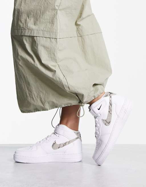 Nike Air Force 1 Mid trainers in white with snakeprint swoosh