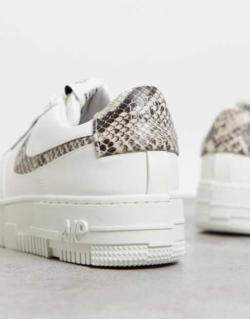 Nike Air Force Pixel trainersin off white and snake print