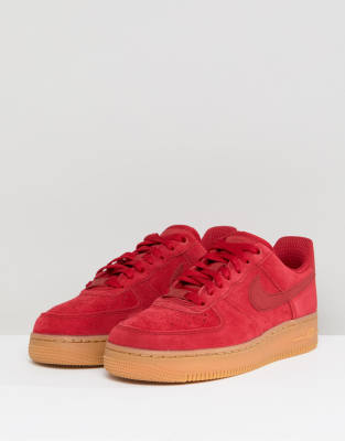 nike air force 1 trainers with red swoosh and gum sole