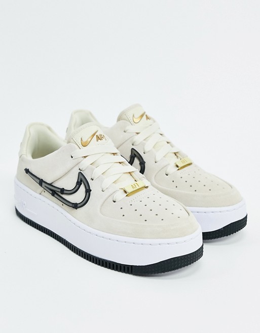 Nike Air Force 1 Sage trainers with metal stitched in swoosh