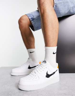 white nike air force with black swoosh