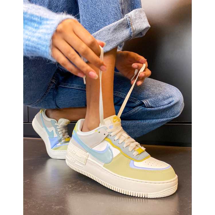 Nike Air Force 1 Shadow trainers in white and marine blue mix