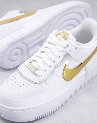 Nike Air Force 1 Shadow trainers in white gold and silver