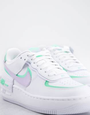 white and lilac nike trainers