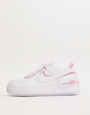 white and pink trainers