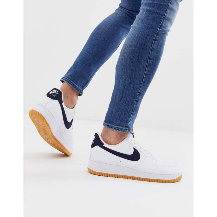 Nike Air Force 1 sneakers with navy swoosh and gum sole ASOS