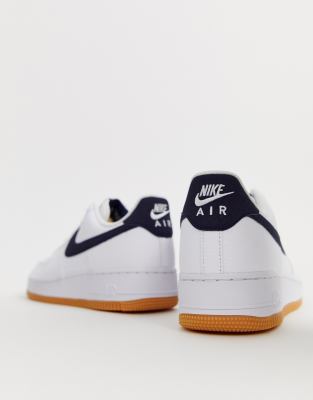 nike air force 1 trainers with navy swoosh and gum sole