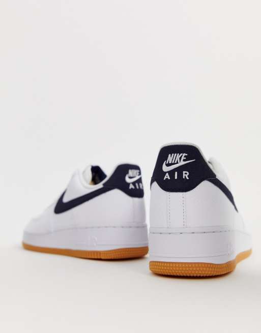 Nike Air Force 1 sneakers with navy swoosh and gum sole ASOS