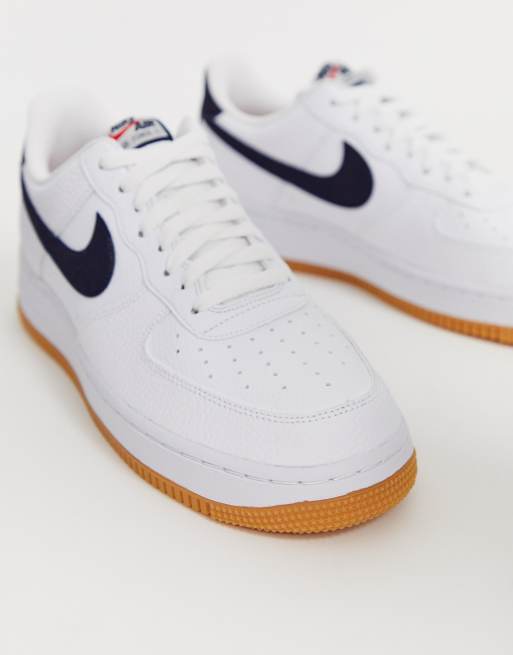 Nike Air Force 1 sneakers with navy swoosh and gum sole ASOS