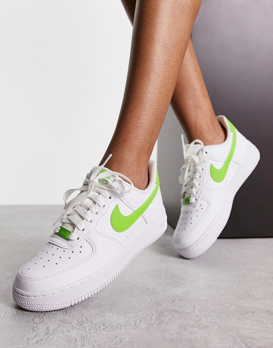 Nike Air Force 1 trainers in white and action green