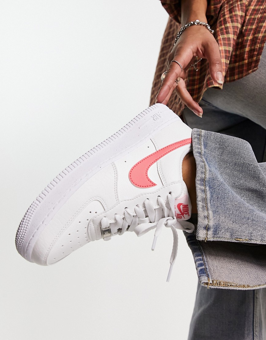Nike Air Force 1 trainers in white and sea coral