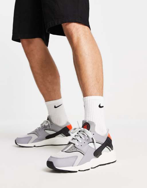 Nike Air Huarache SC trainers in grey and orange ASOS