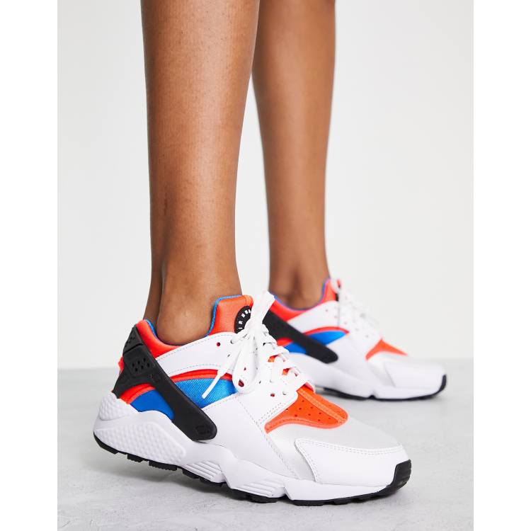 Nike Huarache sneakers in white orange ASOS