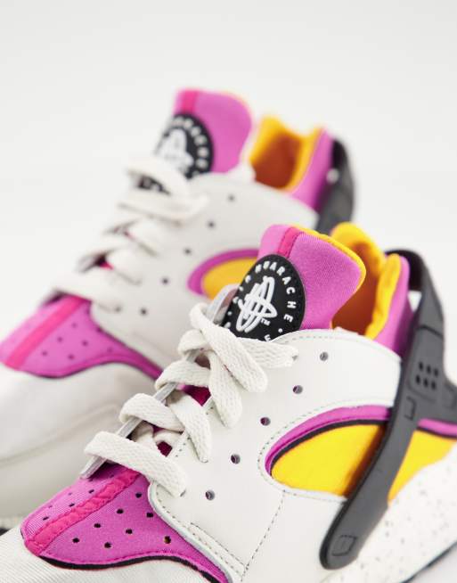 Nike Air Huarache trainers in off white and pink