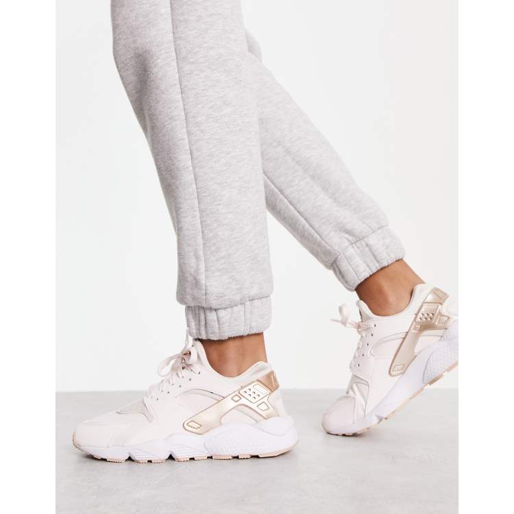 Nike Air Huarache trainers in soft pink and metallic shimmer ASOS