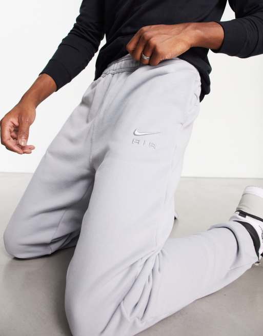 Nike swoosh cuffed joggers best sale in grey