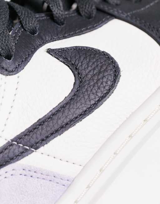 Nike Air Jordan 1 Low sneakers in purple & white